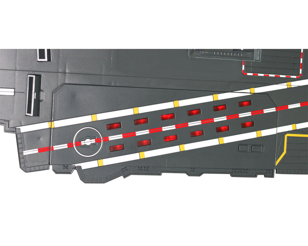 Convenient Storage Compartment located beneath the Flashing Runway Section of the Aircraft Carrier Plasyset. This durable plastic interactive extra large toy aircraft carrier playset includes 4 diecast metal jets, flashing runway lights, authentic sounds and a large storage compartment. Electronic Fleet Command Battle Zone brand playset. RedBox / Motormax