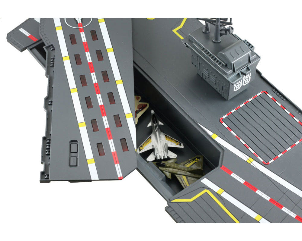 Convenient Storage Compartment located beneath the Flashing Runway Section of the Aircraft Carrier Plasyset. This durable plastic interactive extra large toy aircraft carrier playset includes 4 diecast metal jets, flashing runway lights, authentic sounds and a large storage compartment. Electronic Fleet Command Battle Zone brand playset. RedBox / Motormax